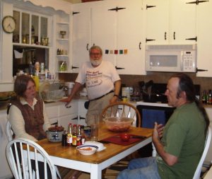 Coleman in the Quaker House kitchen with Chuck & Wendy